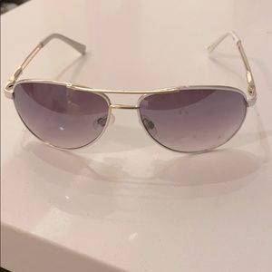 White rimmed sunglasses with case